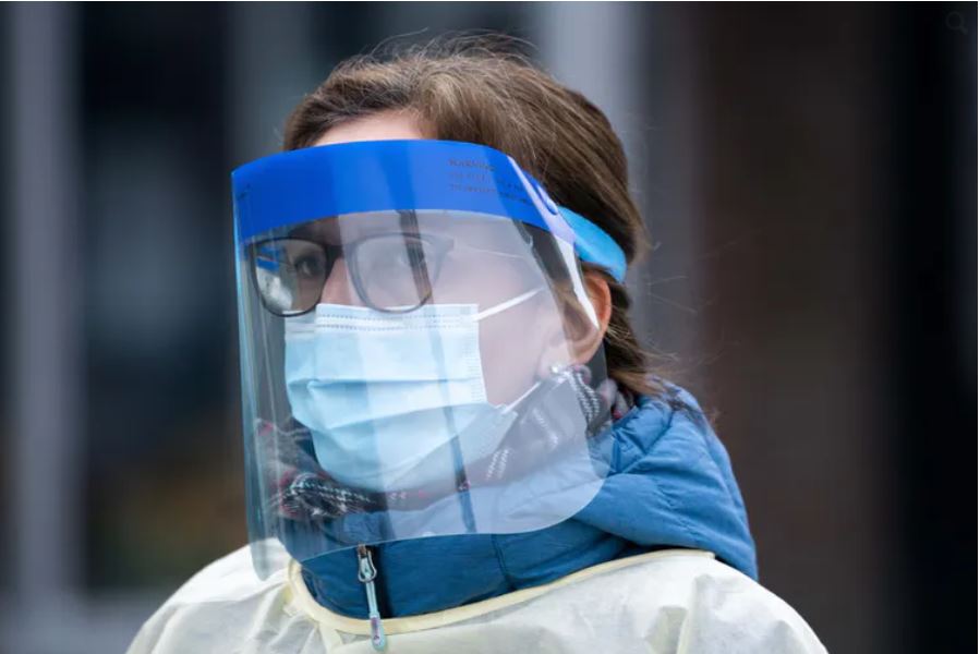A health-care worker arrives at a walk-in COVID-19 test clinic in Montréal on March 23, 2020. Paul Chiasson/THE CANADIAN PRESS